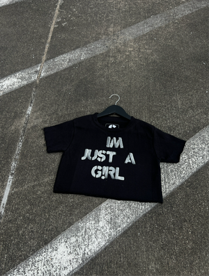 AC “IM JUST A G!RL” CROPPED TEE